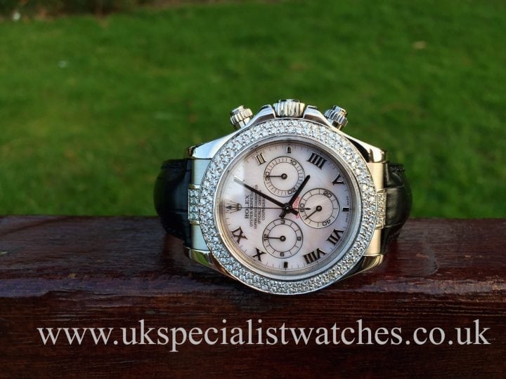 UK Specialist Watches have a white gold Rolex Daytona with silver Mother Of Pearl dial and double diamond bezel.