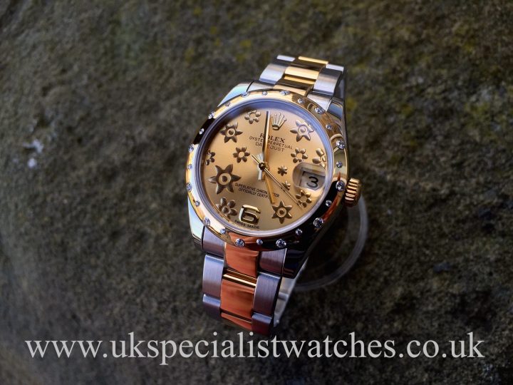 UK Specialist Watches have a mid size bi-metal Datejust with a champagne floral dial with a stunning scattered diamond bezel.