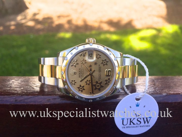 UK Specialist Watches have a mid size bi-metal Datejust with a champagne floral dial with a stunning scattered diamond bezel.