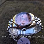 UK Specialist Watches have a 31mm MidSize Datejust in stainless steel with a salmon pink dial.