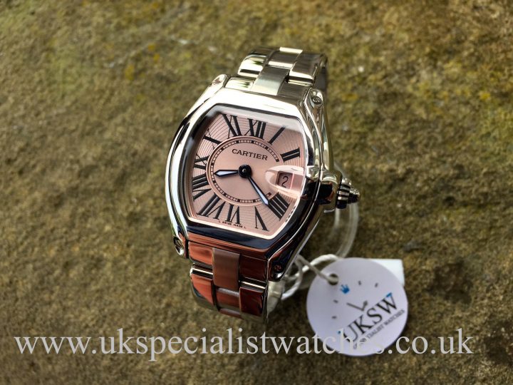 UK Specialist Watches have a mid size cartier Roadster in stainless steel with a pink Roman dial - W62017V3