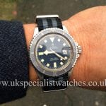 UK Specialist Watches have a 1968 vintageTudor Submariner Snowflake 7021 with the red /black roulette date wheel