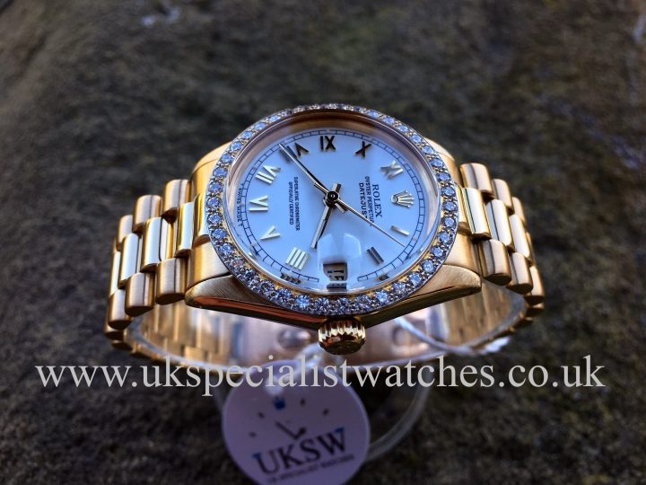 UK Specialist Watches have a Ladies Rolex Datejust mid-size 31mm in 18ct yellow gold with a factory rolex diamond bezel.