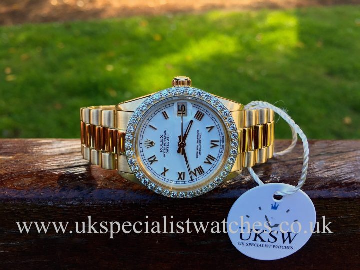 UK Specialist Watches have a Ladies Rolex Datejust mid-size 31mm in 18ct yellow gold with a factory rolex diamond bezel.