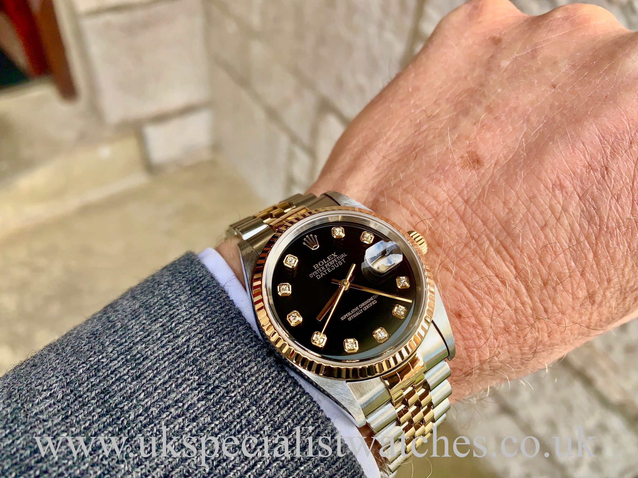 gold and silver rolex black face